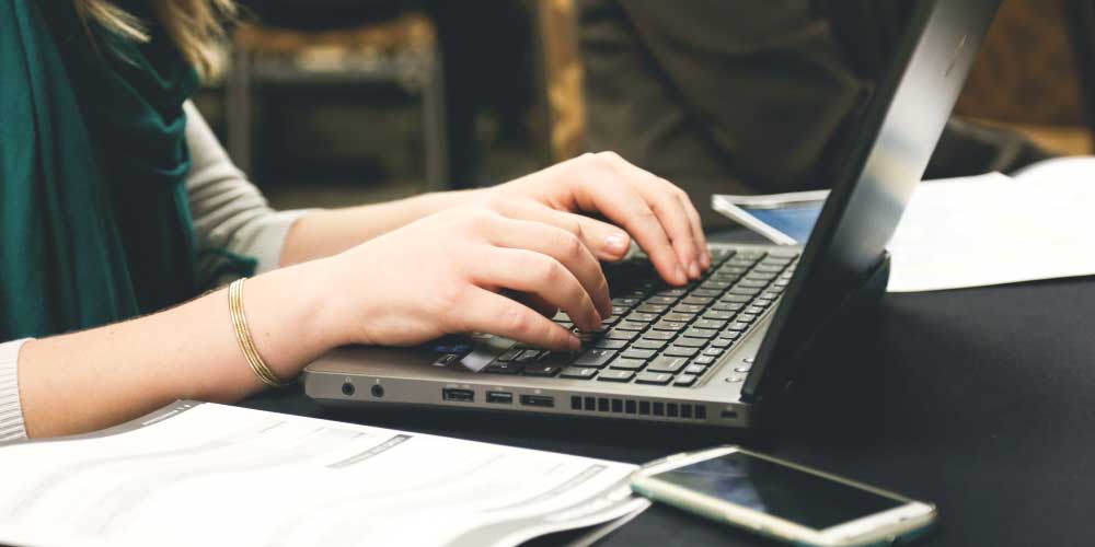 Person using their computer to look for jobs.